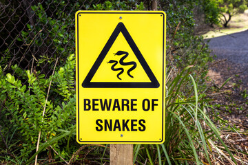 Beware of Snakes sign, Great Otway National Park on the Great Ocean Road, Australia. Australia is home to some of the most venomous snake species in the world.
