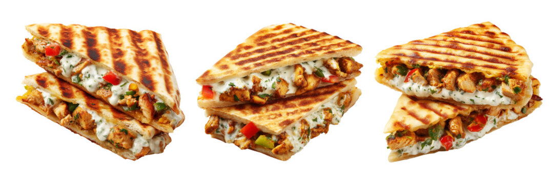 Grilled flatbread sandwich stuffed with seasoned chicken, bell peppers, and creamy herb sauce isolated on white background