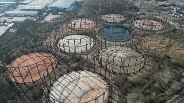 Aerial view of the historic Bromley-by-Bow Gas Works in East London, showing decommissioned Victorian gasholders awaiting regeneration.
