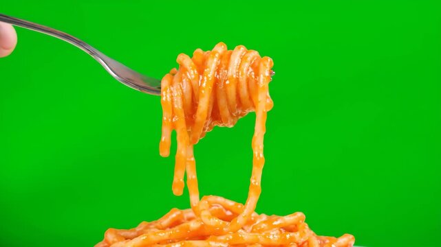 Close-up of a fork expertly twirling a generous portion of spaghetti coated in savory tomato sauce on a green screen.