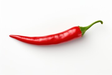 Vibrant red chili pepper laying horizontally on a clean white background