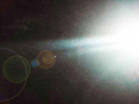 Abstract beam of light in the dark, breaking through the darkness. Effective contrast of light and shadow, mystical or fantastic atmosphere. Concept of hope, mystery, space.
