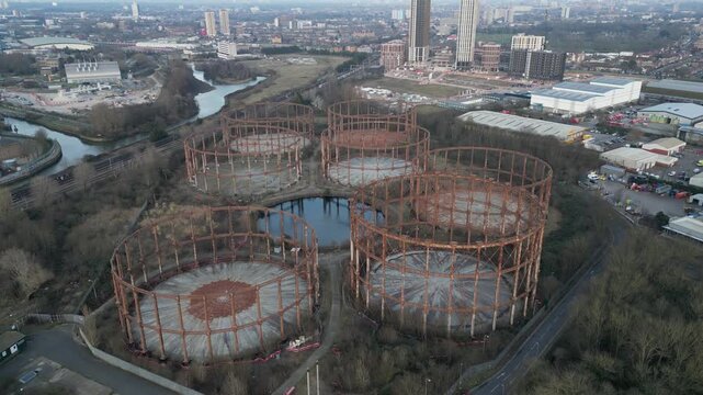 Aerial view of Victorian Bromley-by-Bow gasholders on Twelvetrees Crescent, West Ham, East London, showcasing historic industrial heritage.