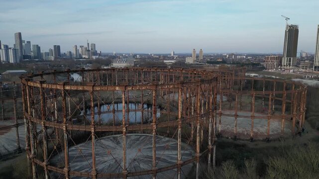 Decommissioned Victorian Bromley-by-Bow gasholders on Twelvetrees Crescent, East London, stand empty, awaiting urban redevelopment.