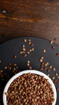 Rotating Top View of Horse Gram (Kulthi Dal) in Bowl &ndash; Healthy Pulse Vertical Footage