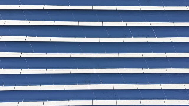 Close view of parallel solar panels covered with snow