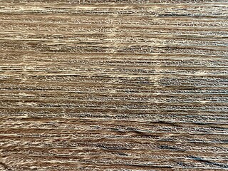 Fototapeta premium Close-up of a rustic weathered wood surface with a detailed grain and natural brown texture.