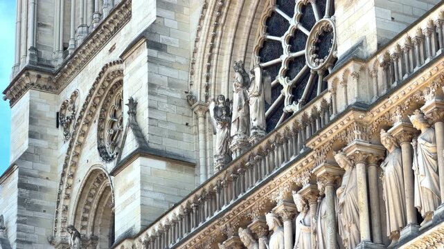 View of the central portal (Last Judgment) and the large rose window on the west front of Notre Dame de Paris cathedral in France