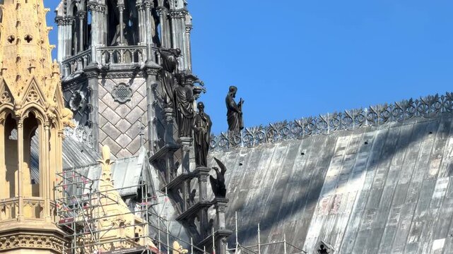 Statues of the apostles and evangelists restored to the base of the new spire of Notre Dame de Paris cathedral