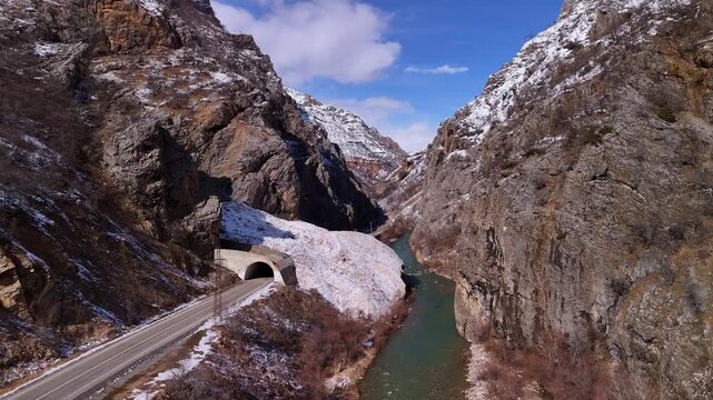 Winter Mountain Tunnel Road Along Turquoise River in Snowy Canyon