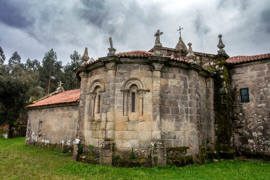 Venerable 12th-century Romanesque apse of San Marti&ntilde;o de Agudelo church with semicircular design and granite ashlar masonry, Barro, Pontevedra, Spain