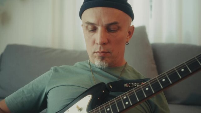 Closeup Of Guitar String Picking. Close Shot Of Fingers Pressing Guitar Frets With Concentration