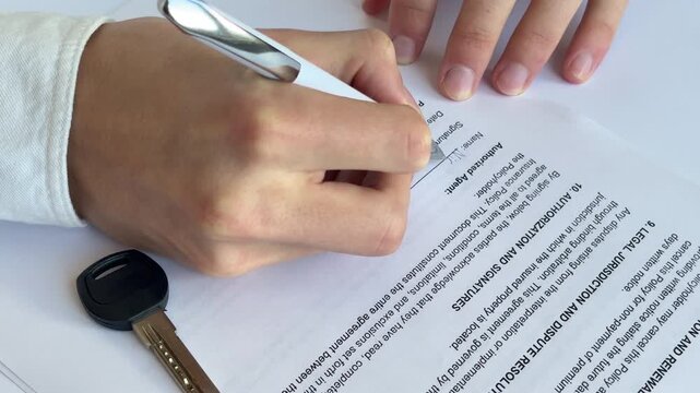 Man signing real estate insurance contract at table, close up