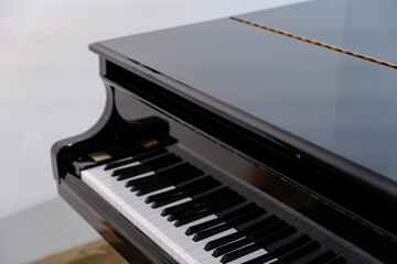 Elegant Grand Piano Keys and Shiny Top with Reflection in Studio Setting