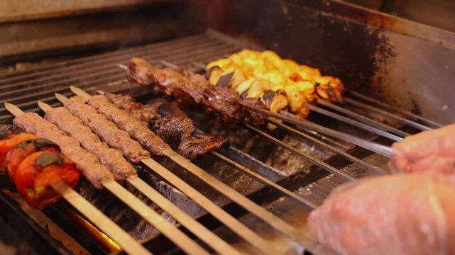 Chef Preparing Mixed Grill Kabobs with Juicy Meat and Vegetables &ndash; Restaurant Kitchen