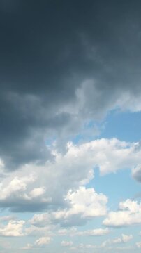 Dark dramatic clouds before a storm. A sky where rain is gradually gathering. The anticipation of a motionless thunderstorm. An abstract background on the theme of bad news.