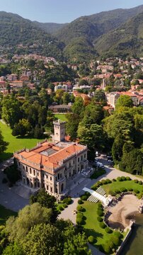 Famous Villa Erba on Lake Como, Italy, historic villa surrounded by greenery, grand lawn and steps, popular luxury wedding venue, national heritage site