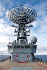 Obraz premium Naval vessel featuring large radar dish and communication systems