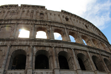 Obraz premium Colosseum silhouette with sunray through arch August 2024 landmark