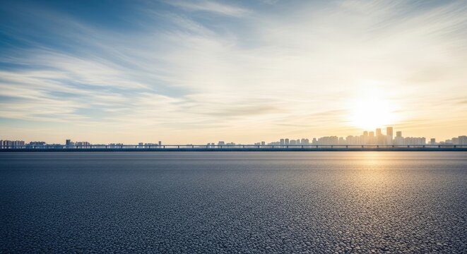 Sunset over city skyline and water with vibrant sky and clouds