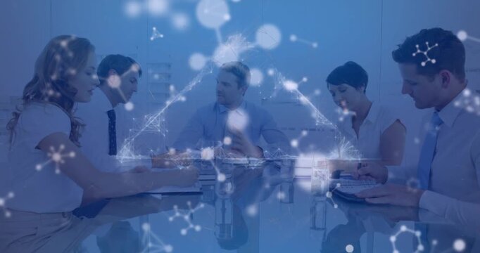 Animation of triangle, floating nucleotides over multiracial coworkers discussing in meeting