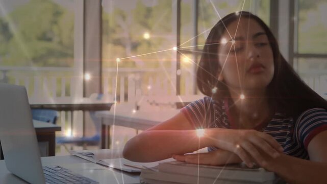 The students in this classroom are attentively using their laptops