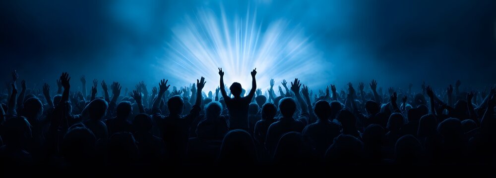 Concert Euphoria: A sea of ecstatic fans with arms raised in exhilaration, silhouetted against a blindingly bright stage light, experiencing the electrifying energy of a live music performance.