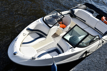 small  nice trip yacht on channel water at sunny day. close up