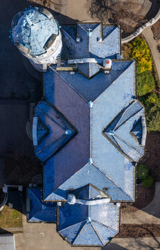 Aerial view of the striking contrasts in the architectural details of the building on Bezrucova, its dark slate roof and the domed tower, Bratislava, Bratislavsky kraj, Slovakia.
