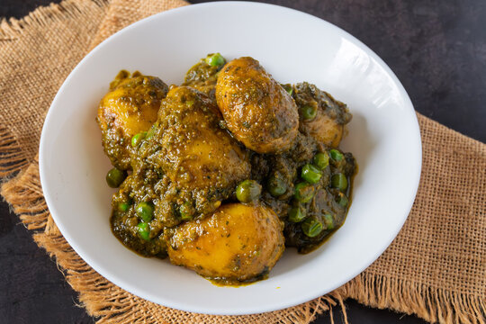 Sobuj Aloor Dum | Bengali Green Masala Potato Curry | Spiced Dum Aloo with Fresh Herb Gravy | Traditional Indian Vegetarian Potato Dish Served in Bowl