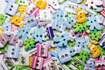 Fototapeta premium a variety of children's plastic buttons for clothes in the form of animals