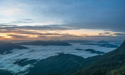 Fototapeta premium Sunrise over mountain range and sea of mist, natural landscape showing morning light and peaceful scenery.