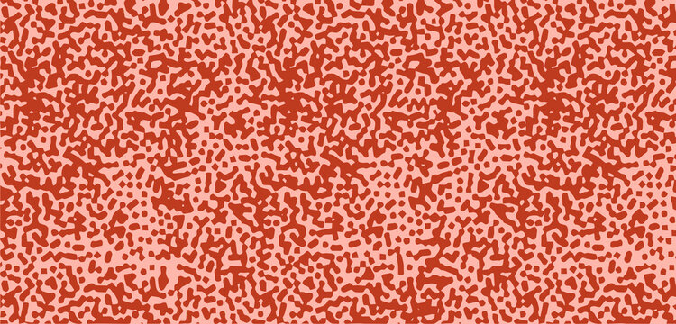 Seamless pattern with abstract orange and red speckled sponge texture