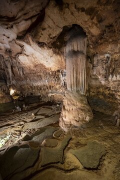 Stalactites and stalagmites, rock formations in a stalactite cave with water basin, Grotta del Fico, Gulf of Orosei, Baunei, Sardinia, Italy