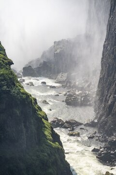 Water plunges into the depths, Victoria Falls with gorge, Zambezi, Zimbabwe