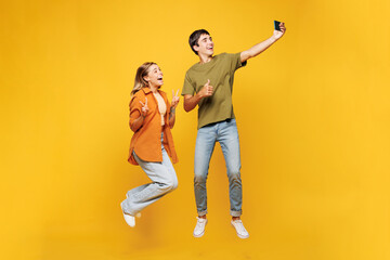 Full body young couple two friends family man woman wear casual clothes together do selfie shot on...