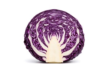Fototapeta premium A purple cabbage is sliced in half. The inside reveals layers that form a spiral pattern. The vibrant color contrasts with the white center. This view shows the shape and details of the vegetable