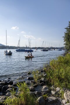 Lake Zurich shore, boats and kayakers, Zurich, Switzerland