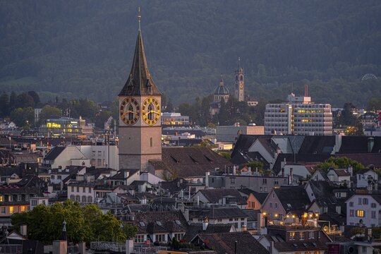 View of the city, St. Peter's church tower, evening mood, Old Town of Zurich, Switzerland