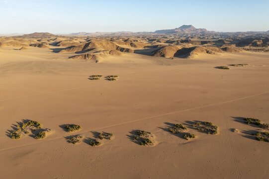 Sandy desert plains and bare mountain ranges, aerial view, drone shot, Damaraland, Kunene Region, Namibia