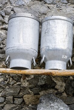 Milk cans at an alpine pasture in the Eng, Tyrol, Austria