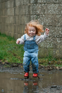 The joy of a child jumping in a puddle in rural Ireland