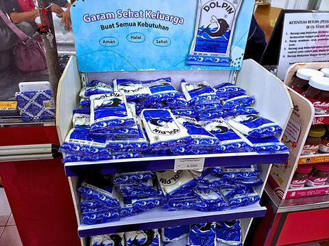 Denpasar, Indonesia - August 20, 2025: Packages of Dolpin brand salt displayed for sale in a local grocery store or supermarket.
