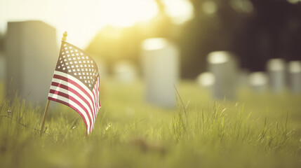 Memorial Day Tribute with American Flag in Cemetery Grass Highly realistic cemetery composition, American flag planted in green grass foreground, slightly angled pole, soft golden