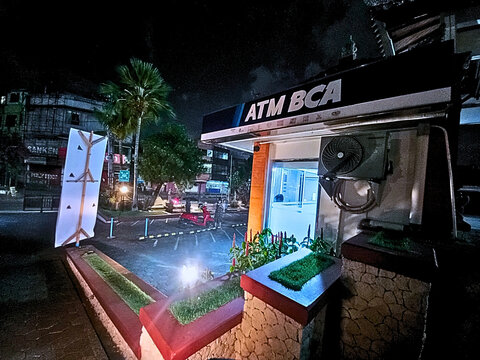 Denpasar, Indonesia - August 20, 2025: Signboards displaying Sanken, Polytron, and ATM BCA logos outside a commercial building or store.