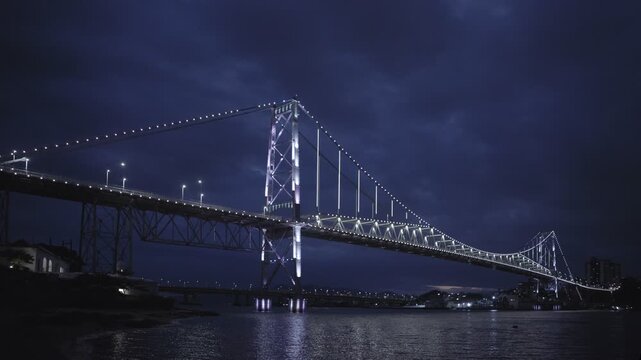 Florianopolis, night view of the Herc&iacute;lio Luz suspension bridge with the Santana fort in the left side