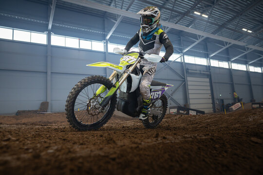 Latvia, Riga August 27, 2025,  regular training Motocross Rider on Dirt Bike in Indoor Arena
