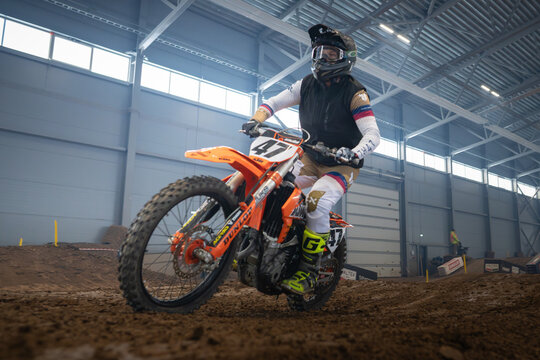 Latvia, Riga August 27, 2025,  regular training Motocross Rider Balancing on Dirt Bike in Indoor Arena