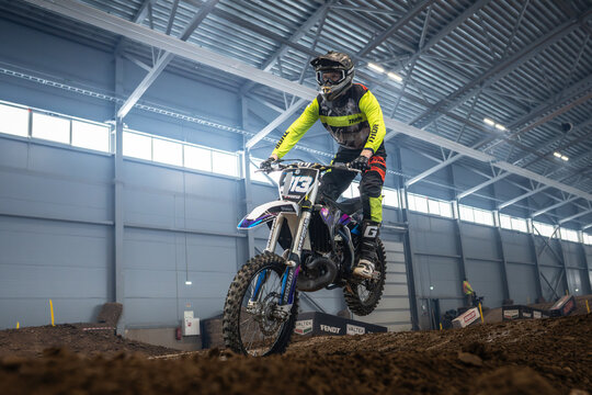 Latvia, Riga August 27, 2025,  regular training Motorcyclist performing a stunt in an indoor arena