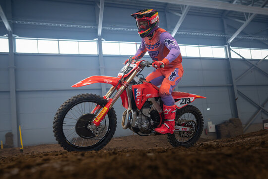 Latvia, Riga August 27, 2025,  regular training Motocross Rider Performing a Jump in Indoor Arena